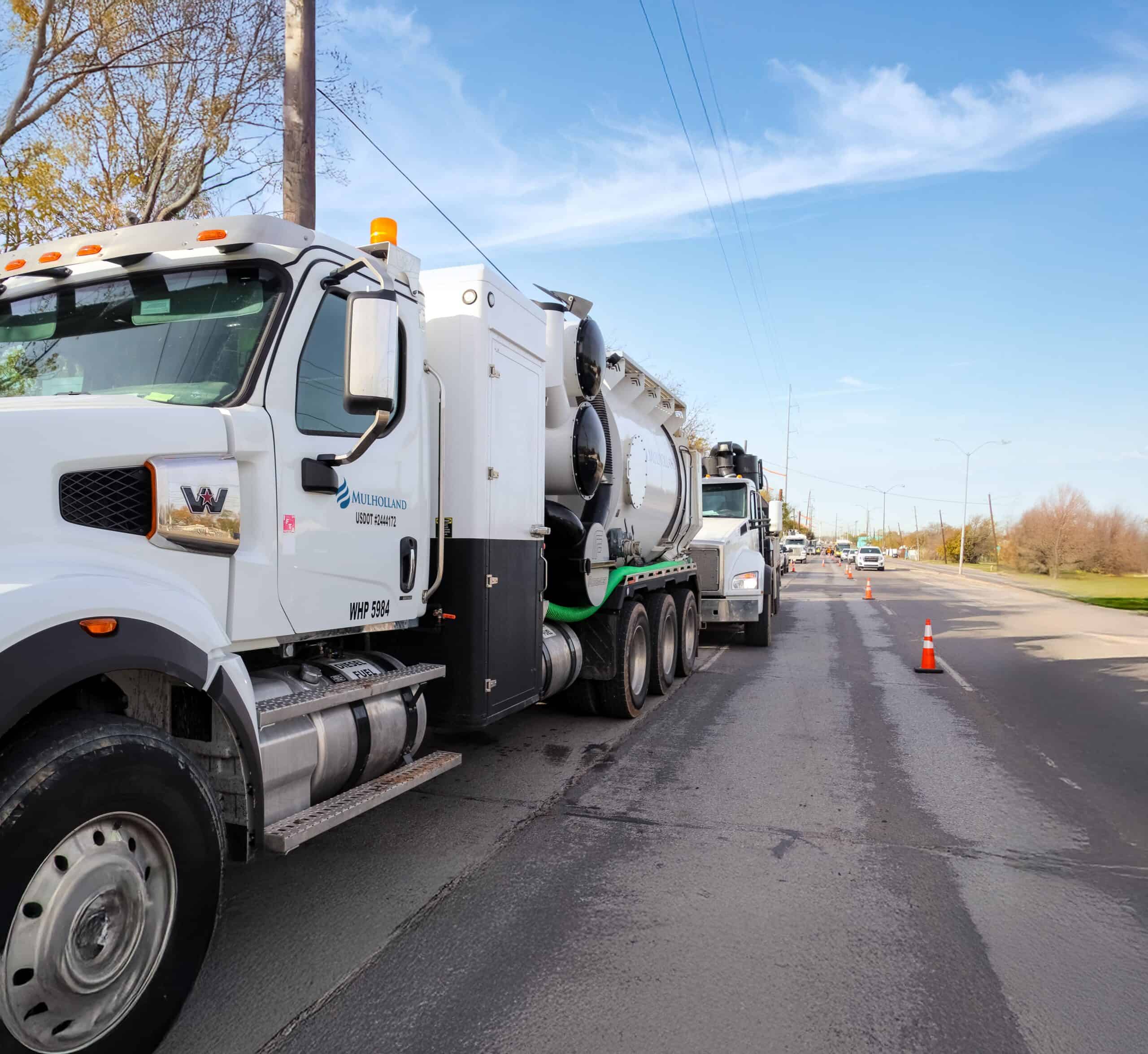 A white truck parked on the road.